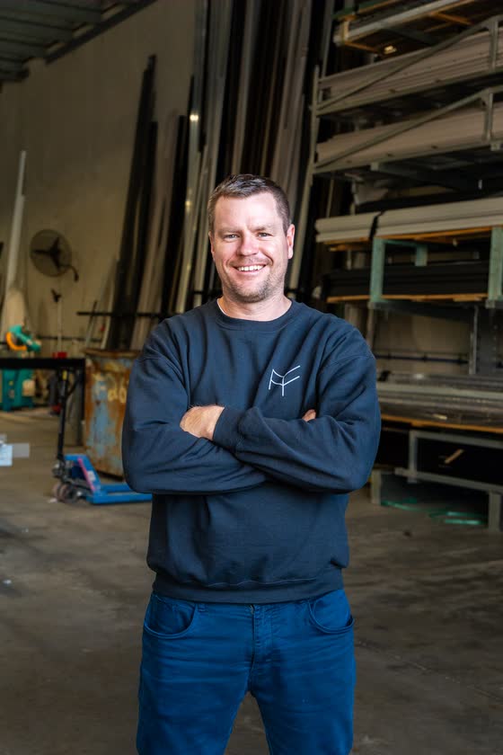 Business owner standing in his workshop
