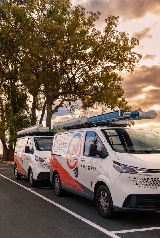 Branded trade vans parked outside a job